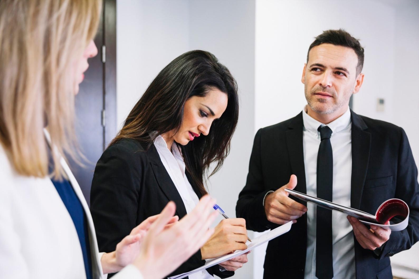 Students engaged in interactive financial planning workshop with measurement tools